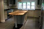 Painted shaker kitchen with island unit showing range